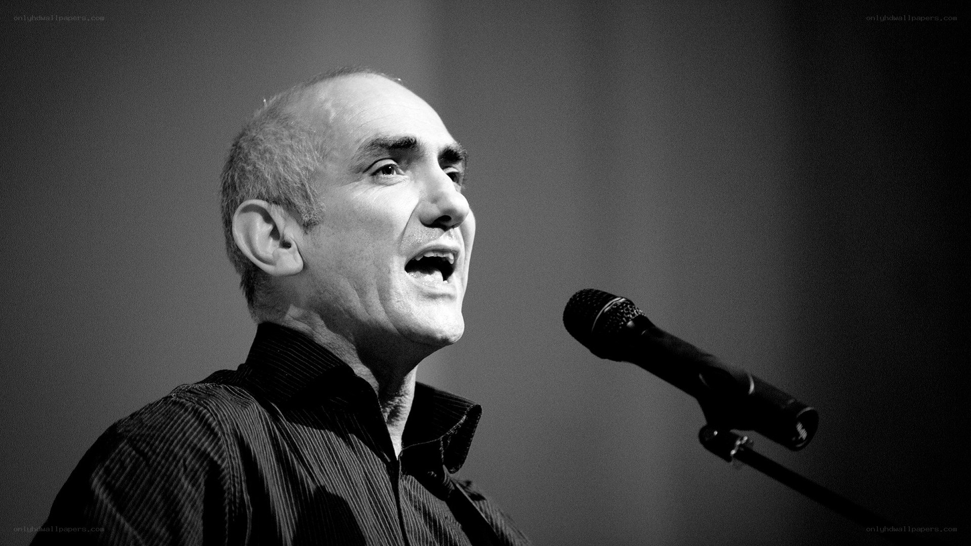 man speaking into microphone