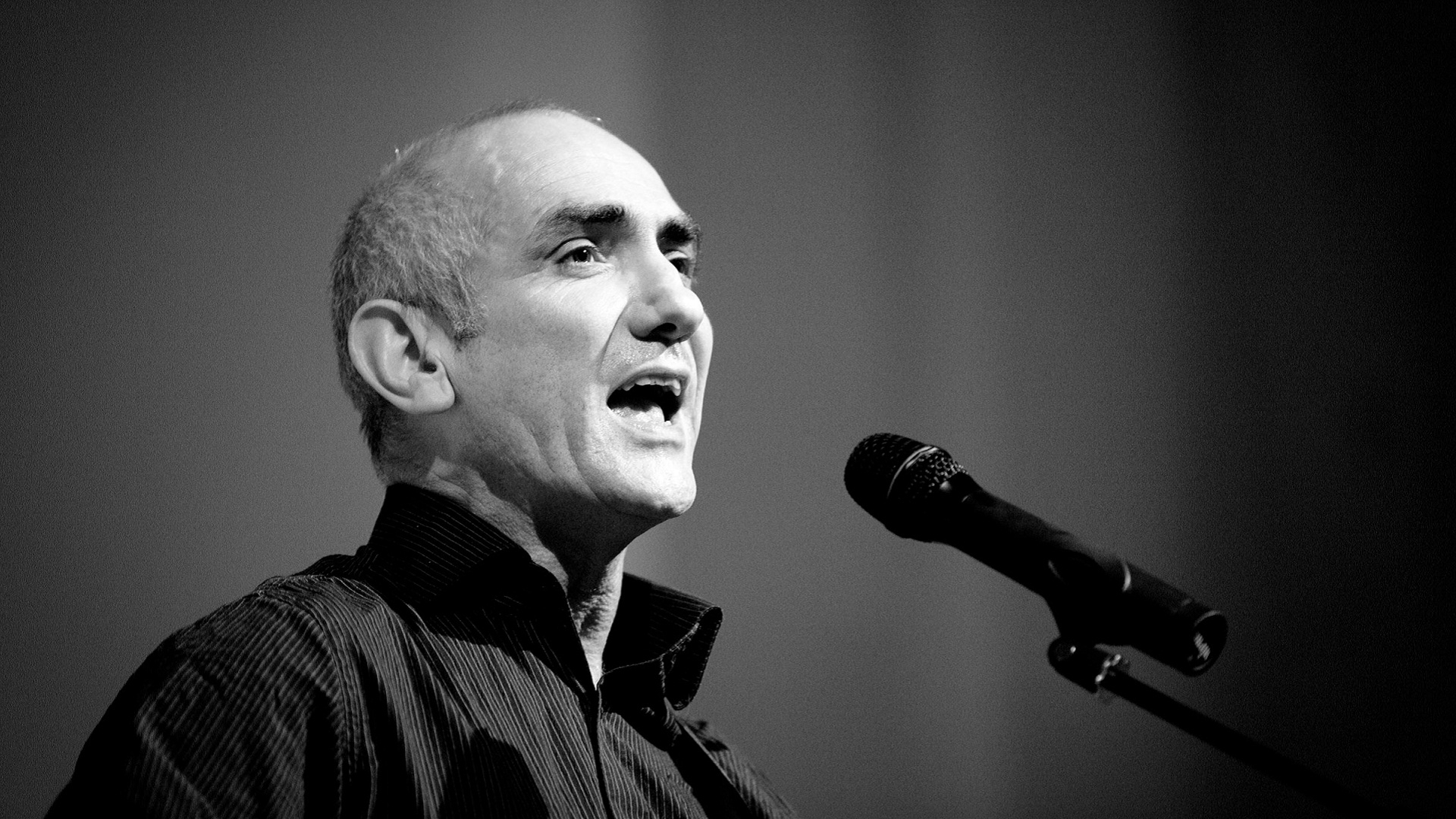 man speaking into microphone