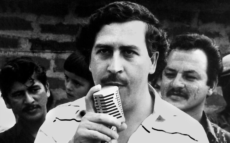 Man Speaking into Microphone — Black, Serious, Photograph, Men