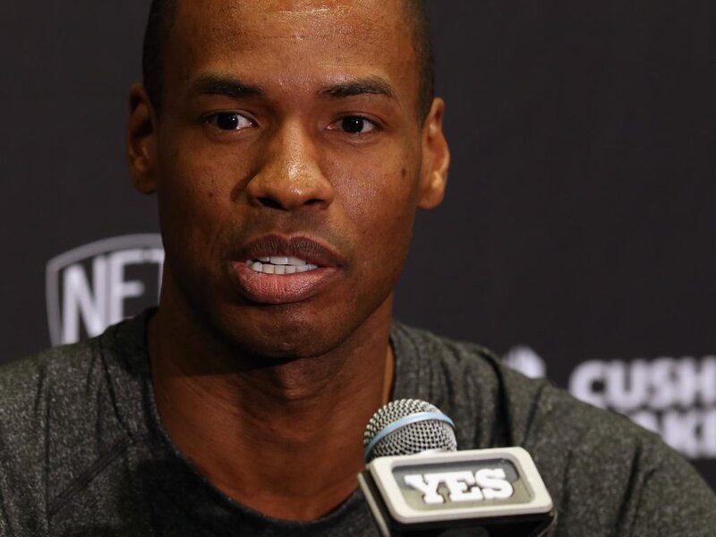 Man Speaking into Microphone — Black, Serious