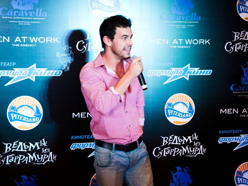 Man Speaking into Microphone — Blue, Formal
