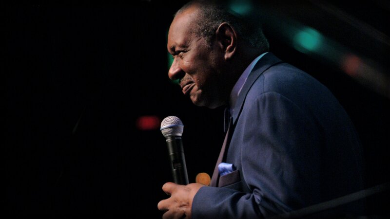 man speaking into microphone
