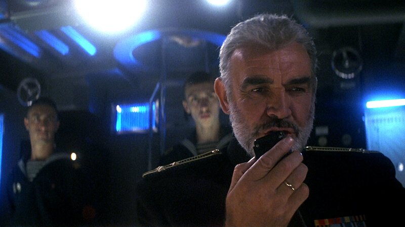 man speaking on radio in submarine