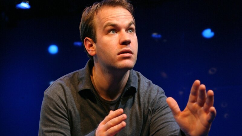 man speaking on stage