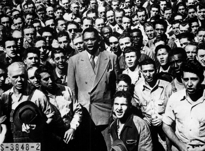Man speaking to a crowd