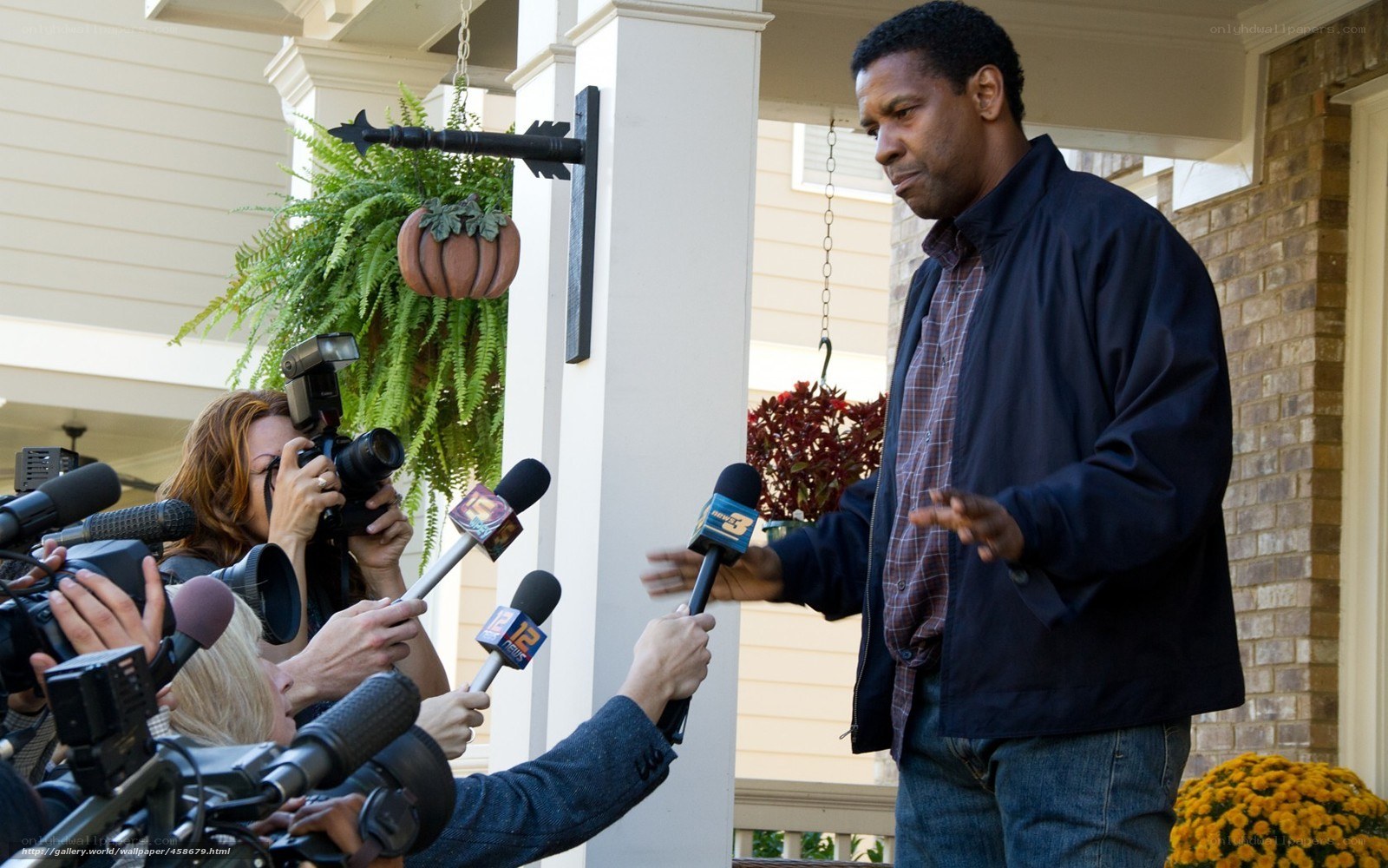 man speaking to reporters