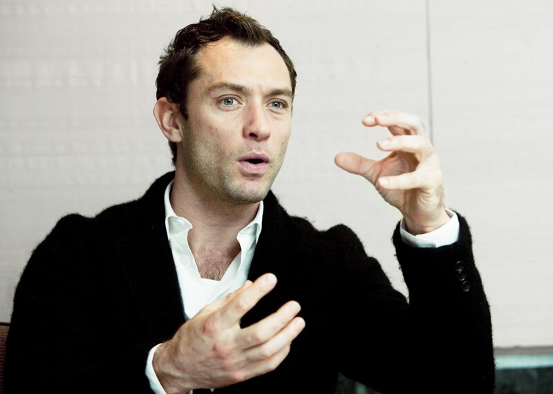 man speaking with hands gesturing
