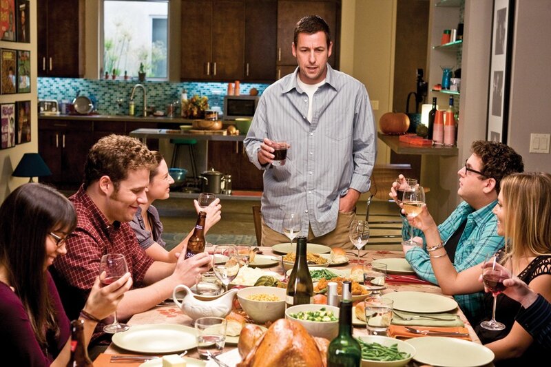 Man Standing at Dinner Table