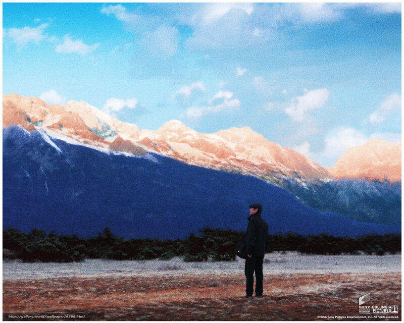 Man standing before mountains