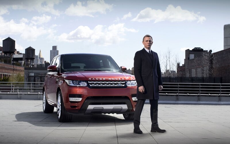 Man Standing Beside Car — Red, Dramatic, Afternoon