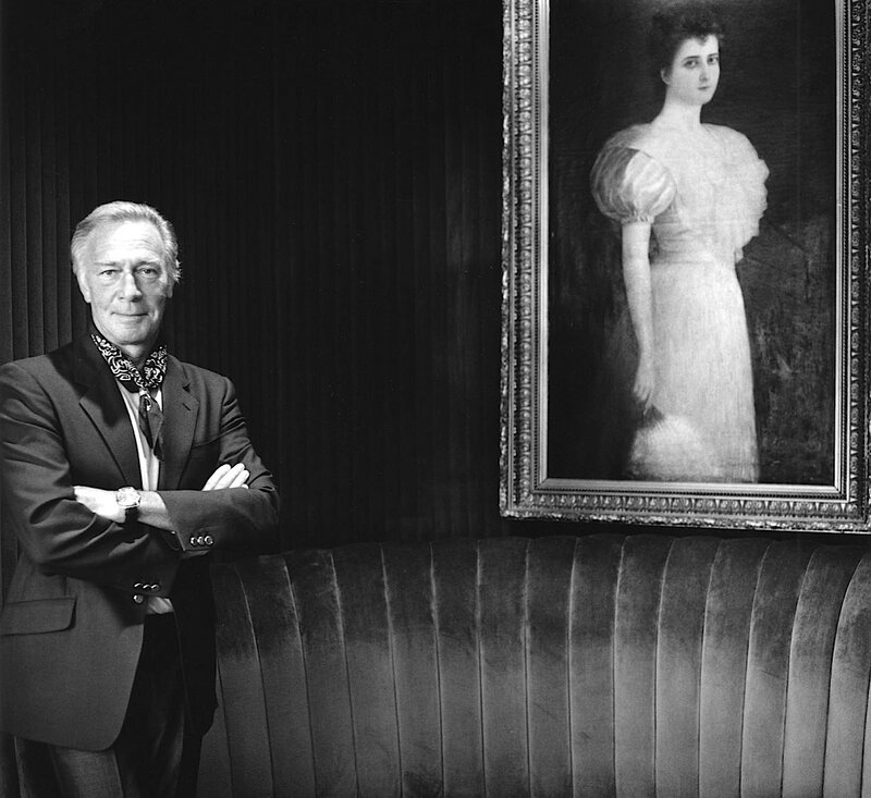 Man Standing Beside Portrait