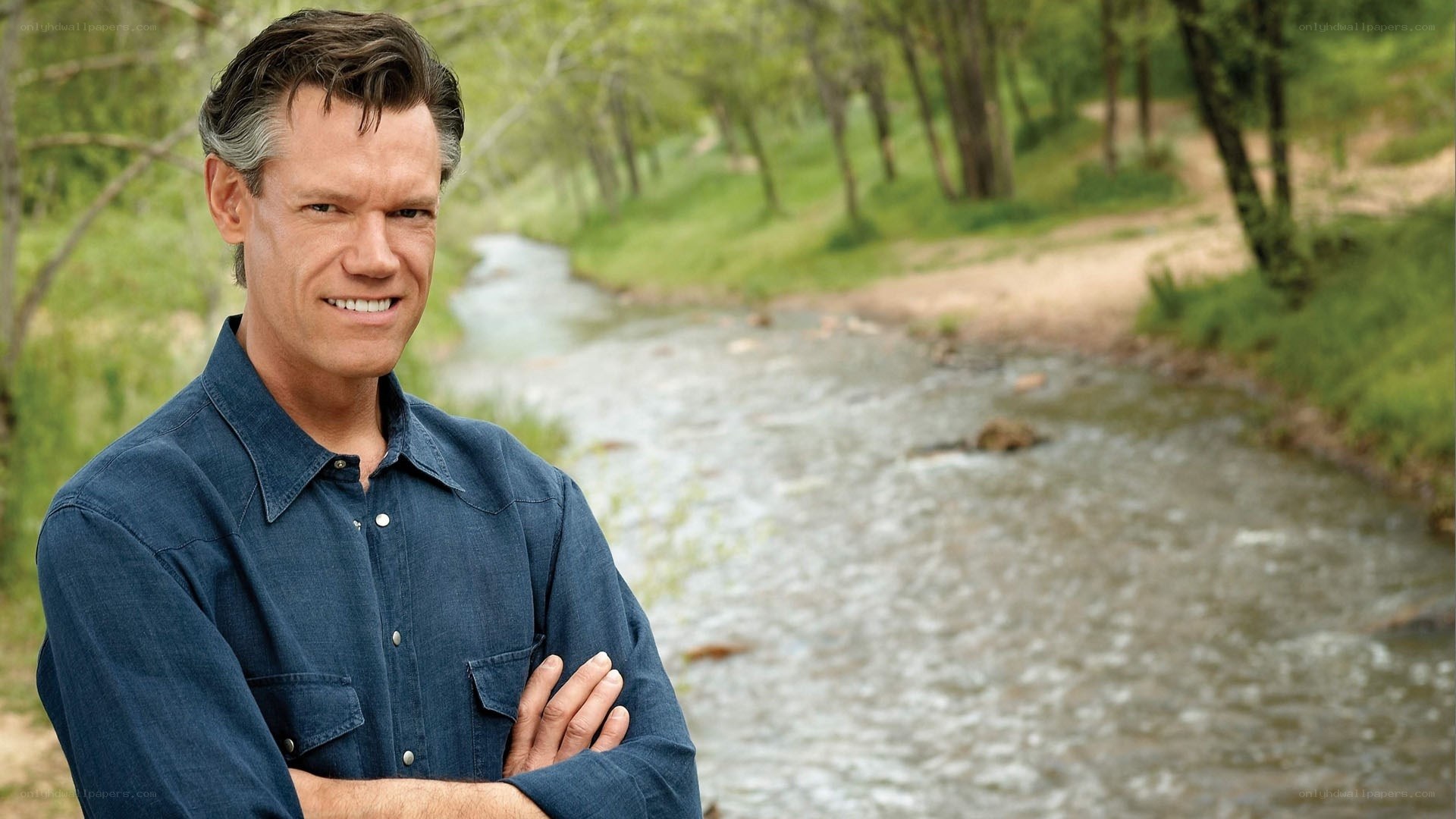man standing by a river