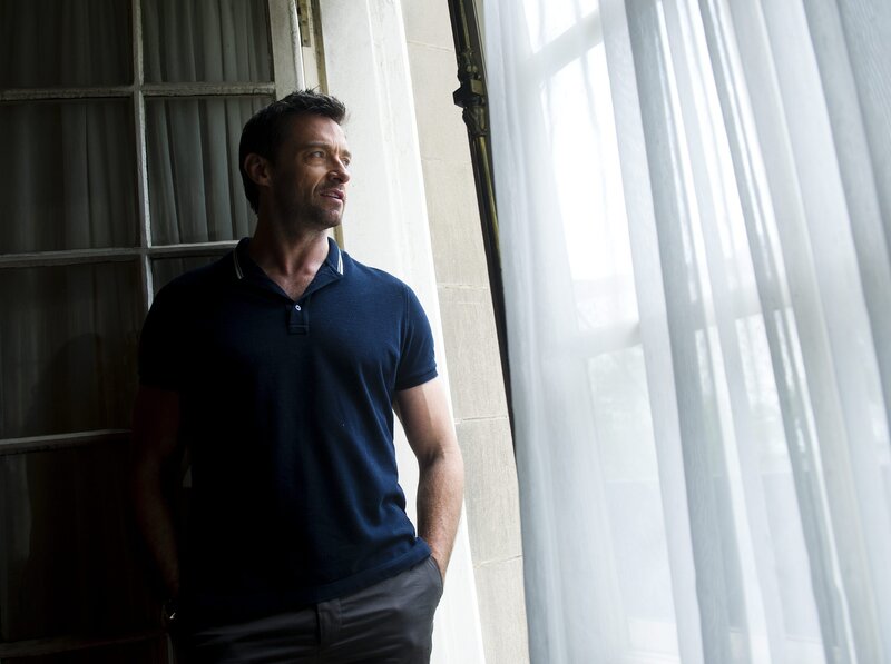 man standing by a window