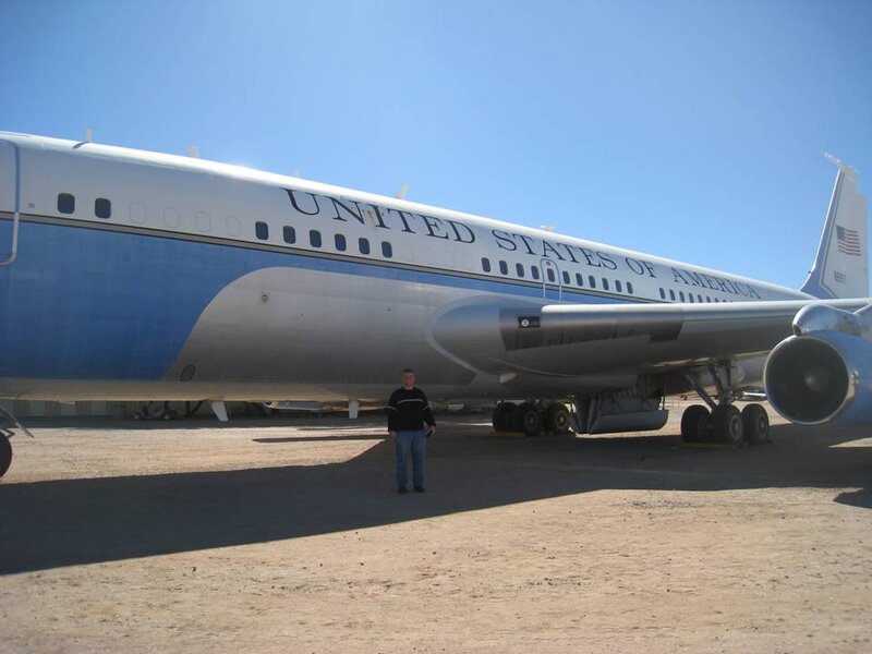 Man Standing by Airplane