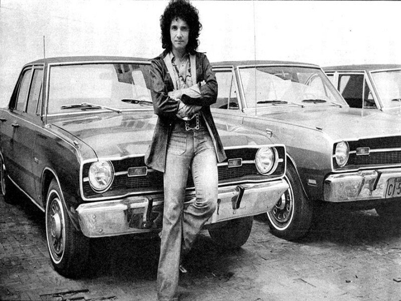 Man Standing by Cars