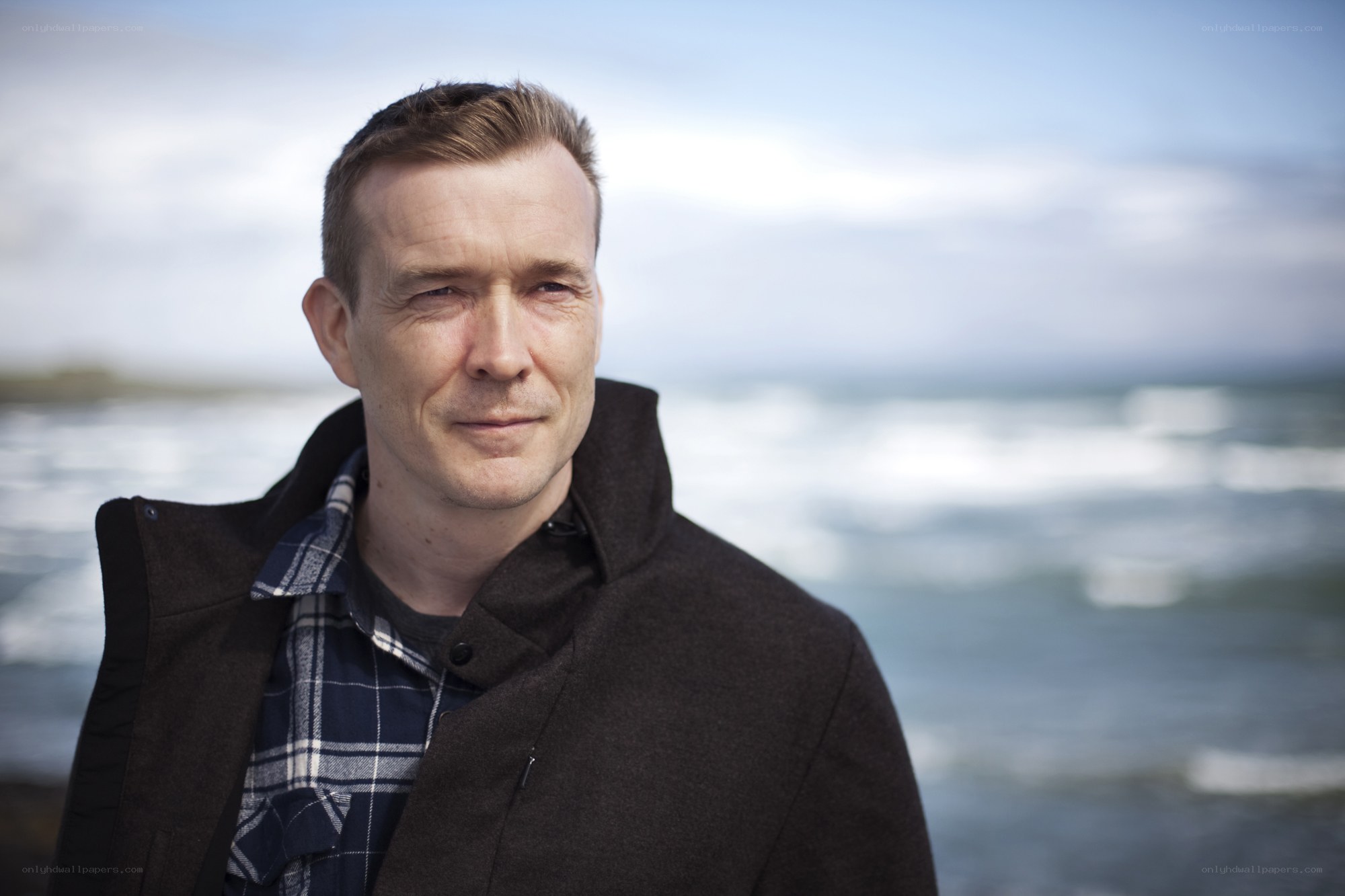 man standing by the sea