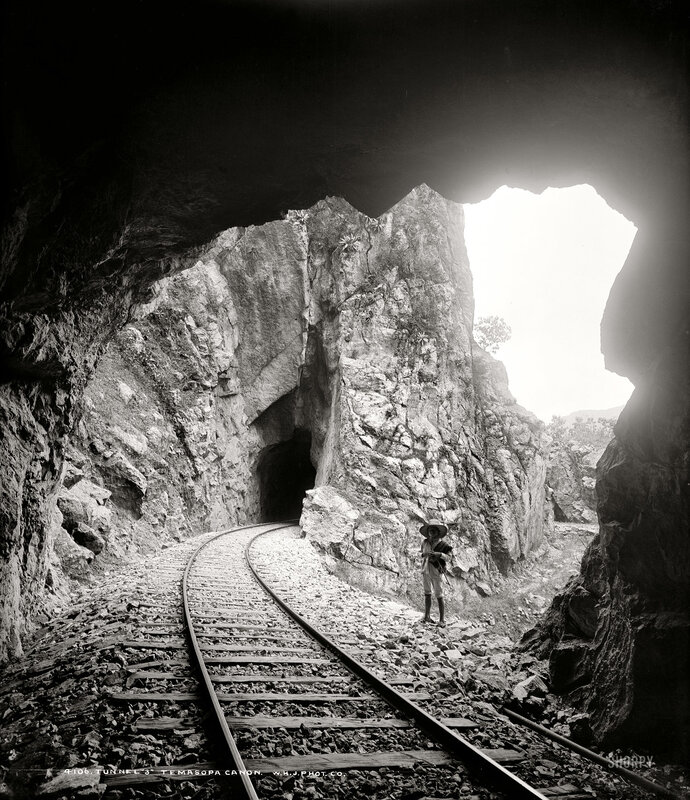 Man Standing by Train Tracks