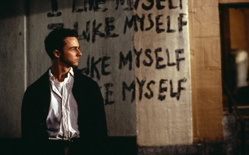 Man Standing by Wall — Gray