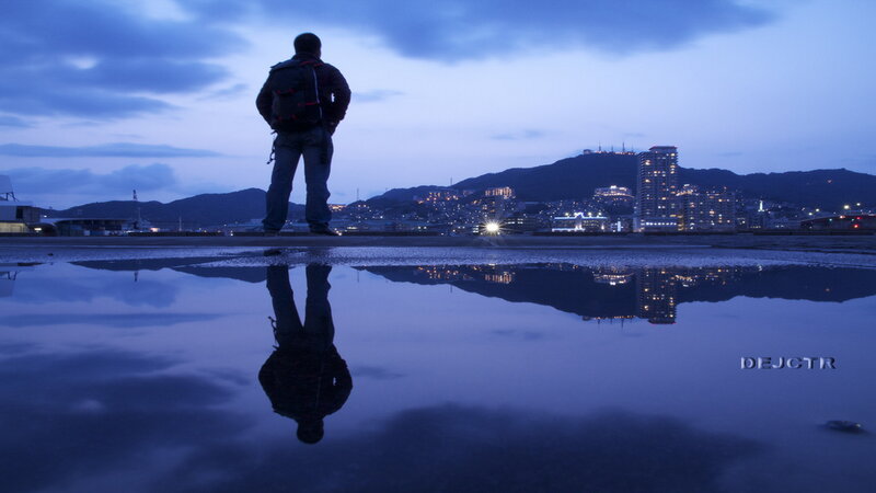 Man Standing by Water