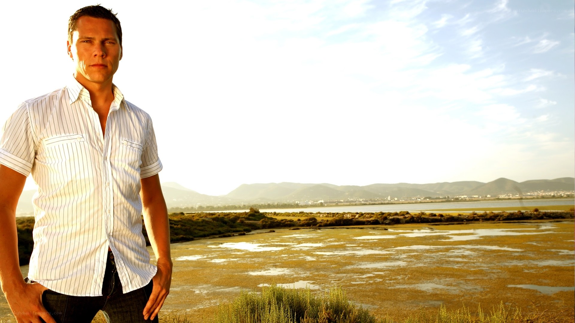 man standing by wetlands