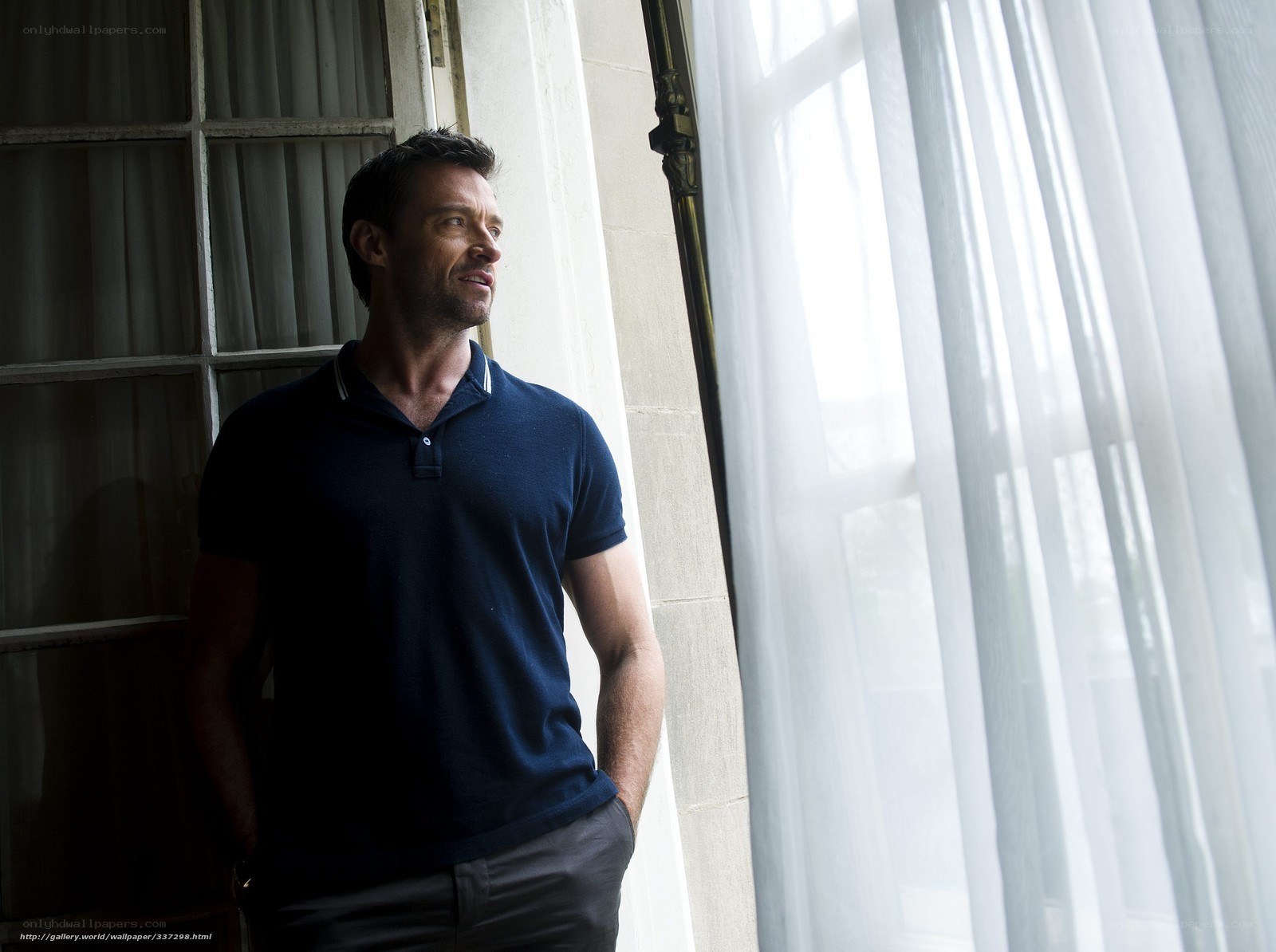 man standing by window