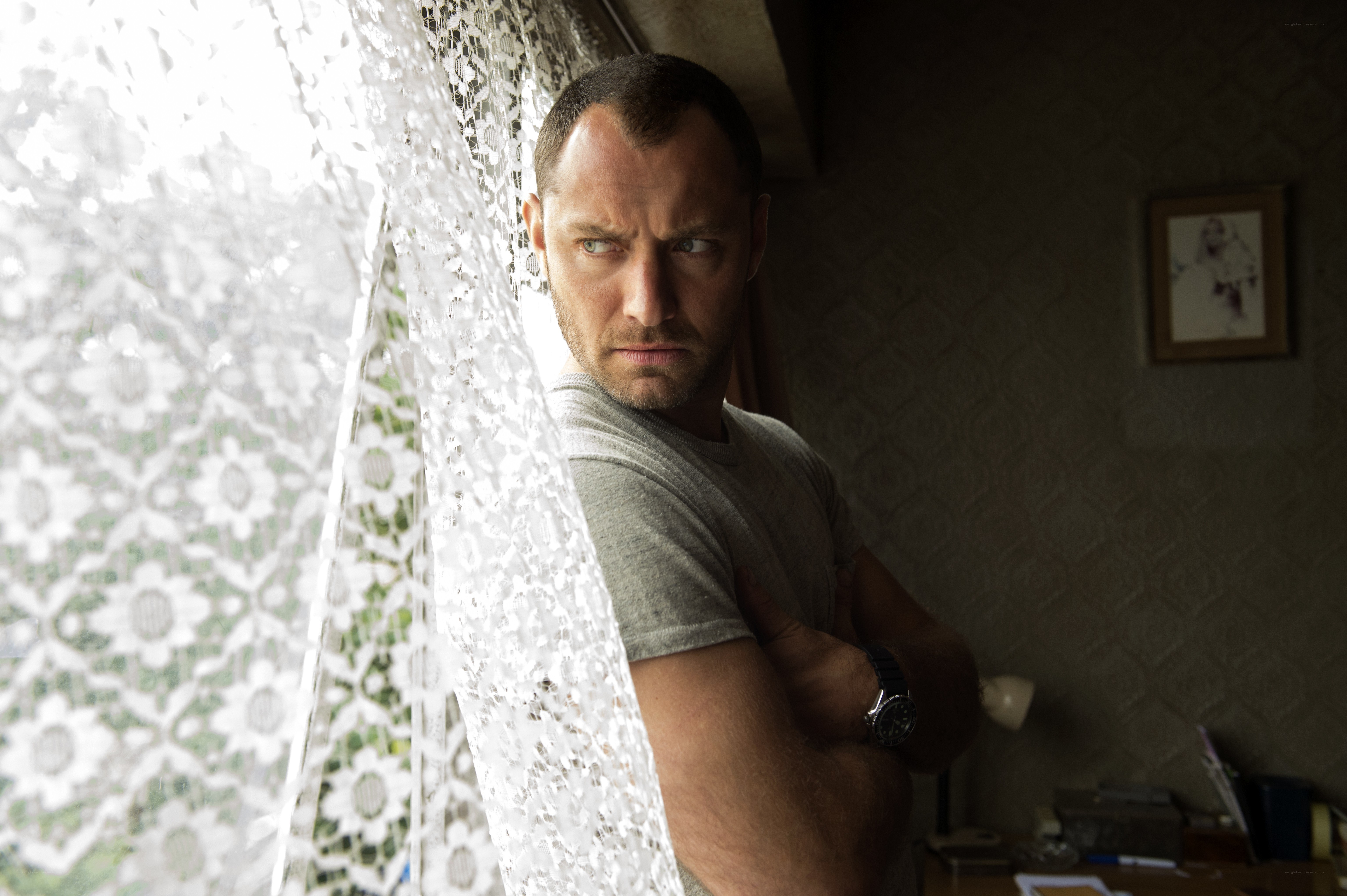 man standing by window