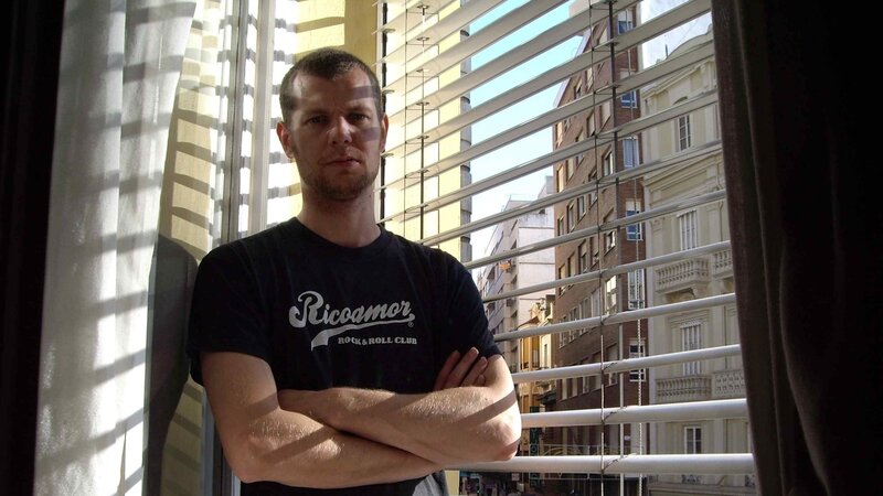 Man standing by window