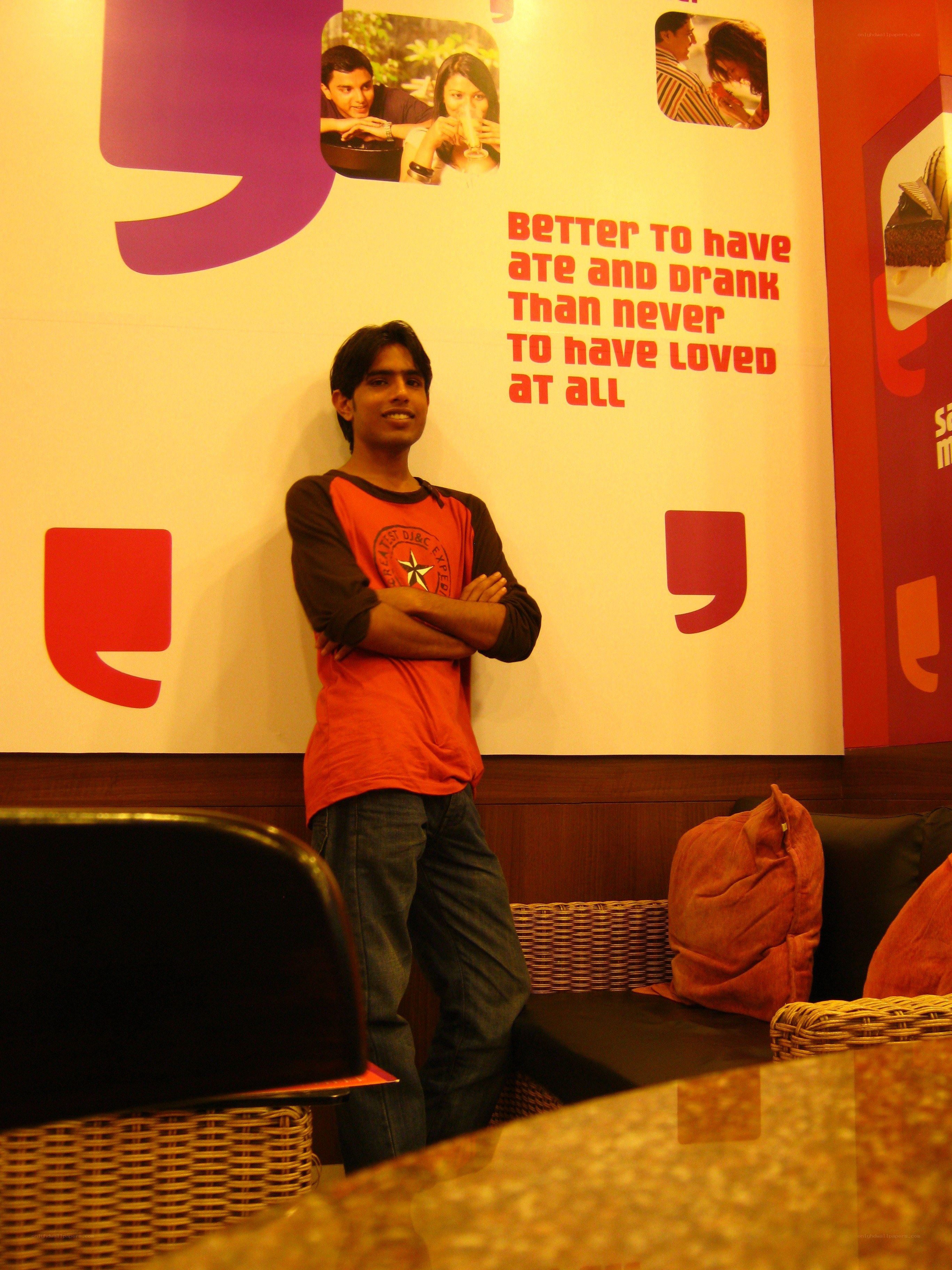 man standing in cafe