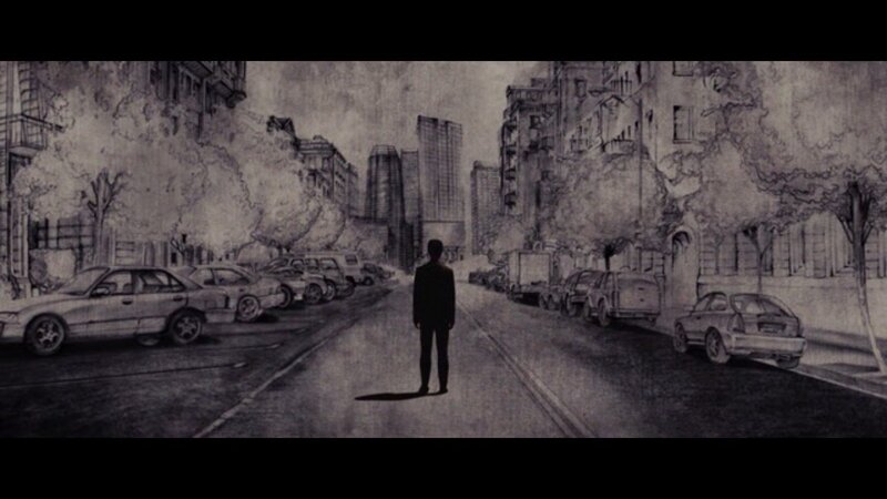 man standing in city street