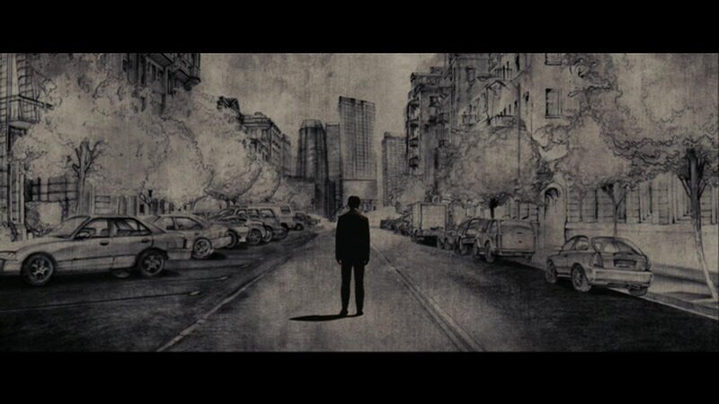man standing in city street