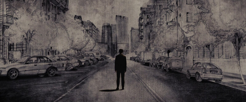 man standing in city street