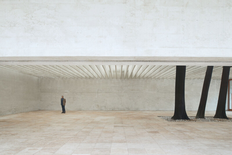 Man Standing in Courtyard