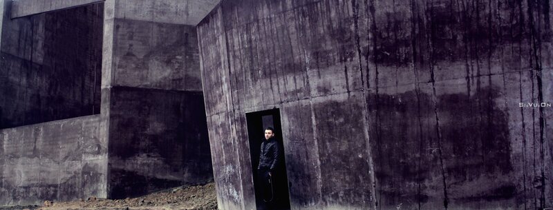 Man Standing in Doorway — Gray