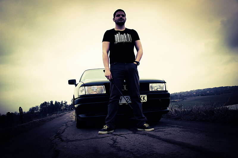 Man Standing in Front of Car — Black