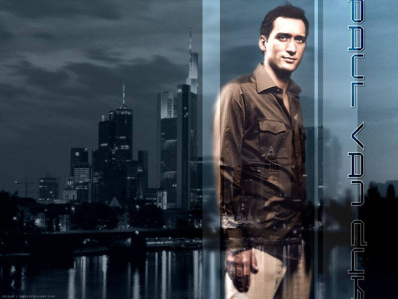man standing in front of city skyline