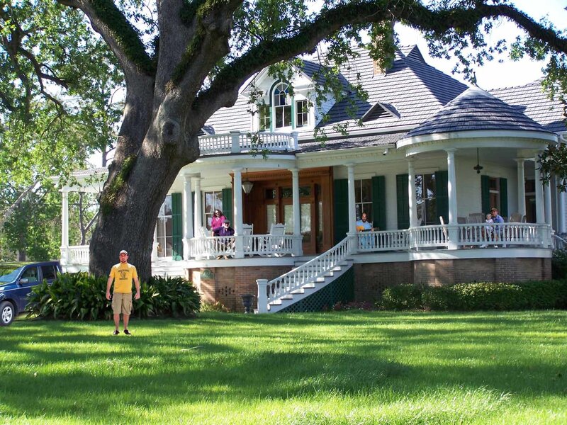 Man Standing in Front of House