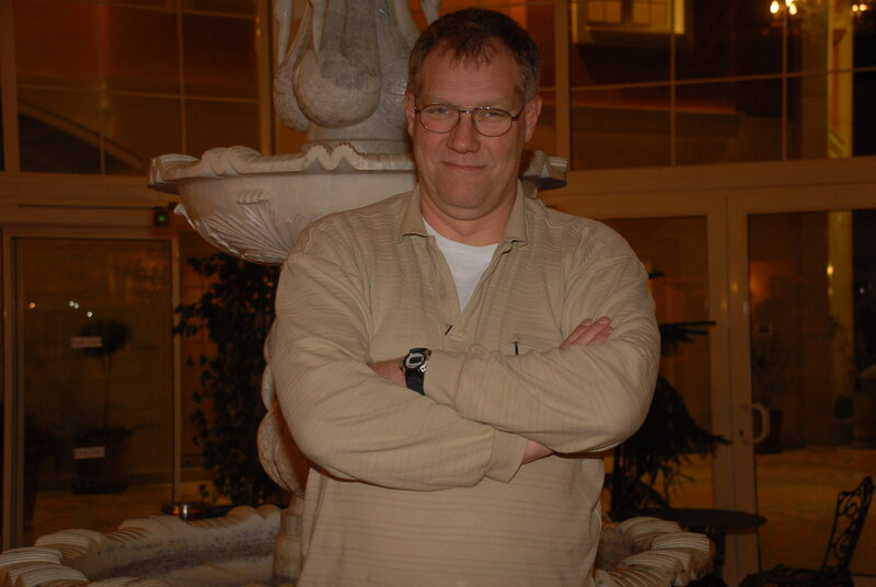 Man Standing in Lobby