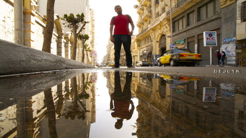 Man Standing in Puddle — Yellow