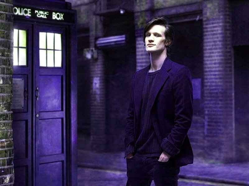 Man Standing Near Phone Box
