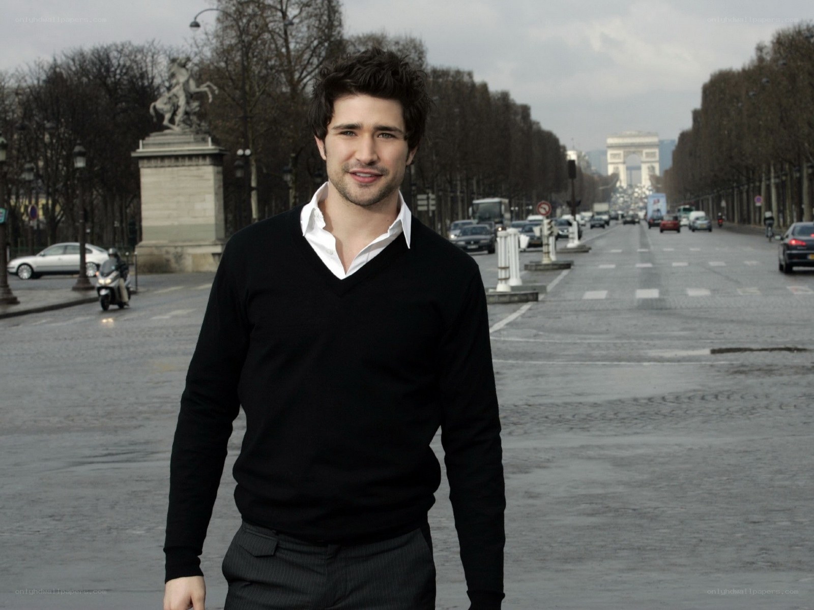 man standing on a paris street