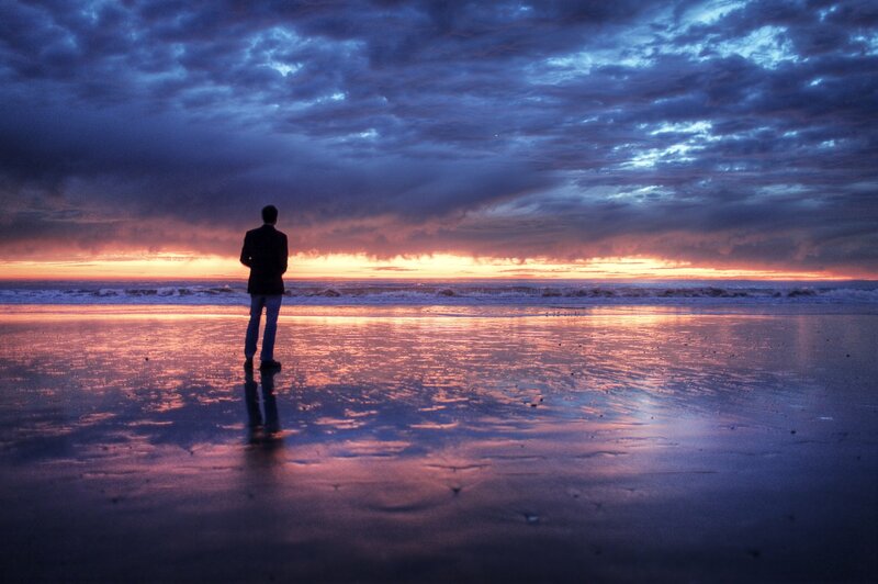 Man Standing on Beach — Blue, Dramatic