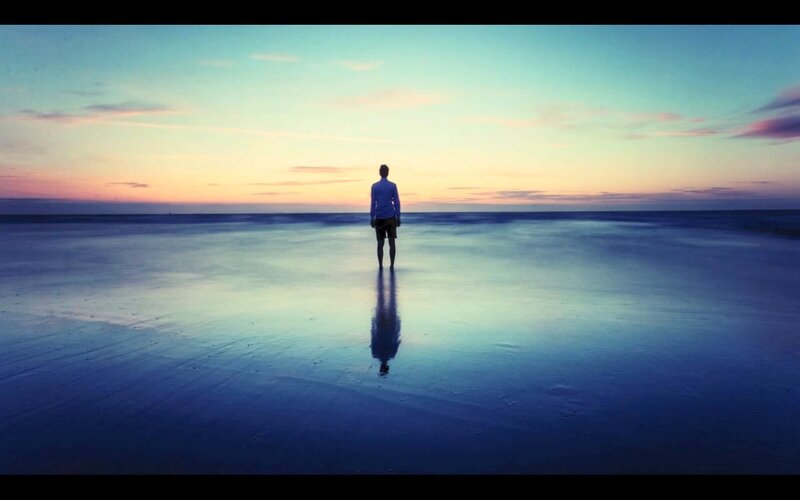 Man Standing on Beach — Blue, Serene, Sunset