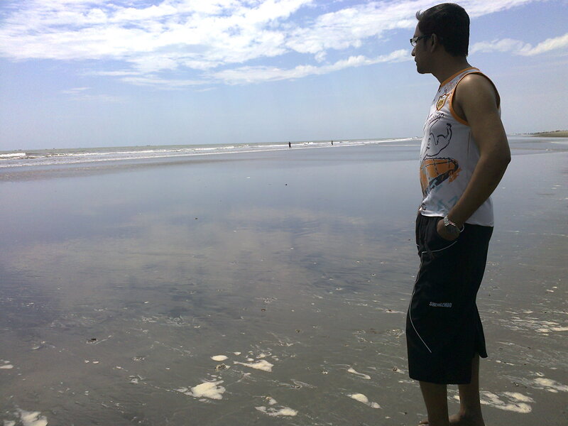 Man Standing on Beach — Blue