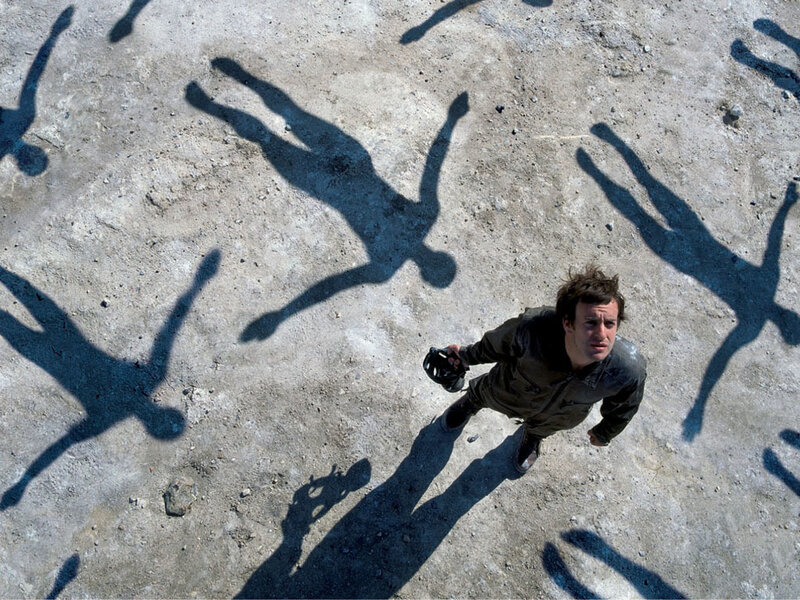 Man Standing on Ground — Gray, Dramatic