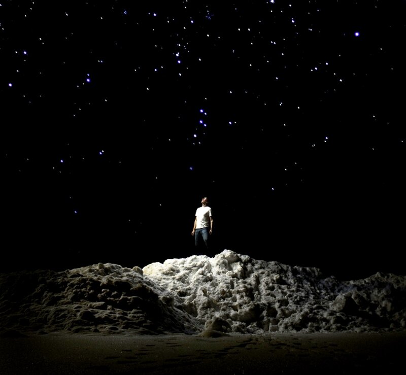 Man Standing on Rock — Black