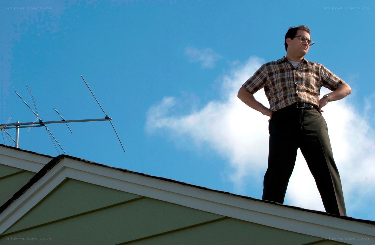 man standing on roof