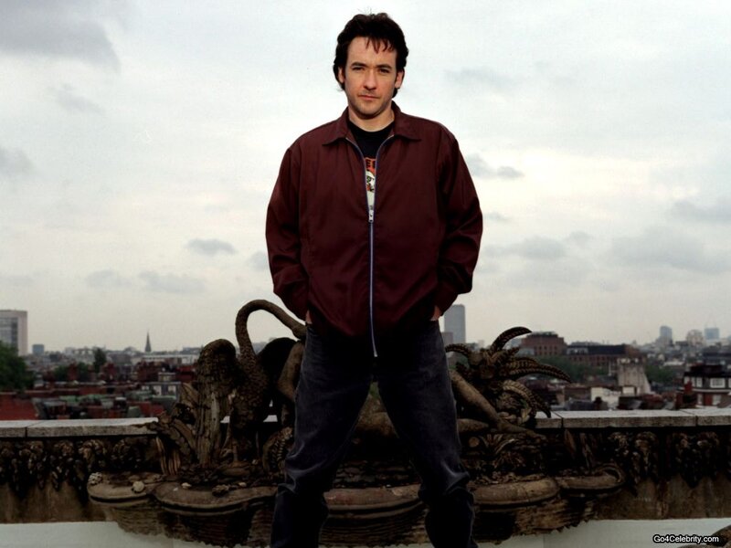 Man Standing on Rooftop — Maroon