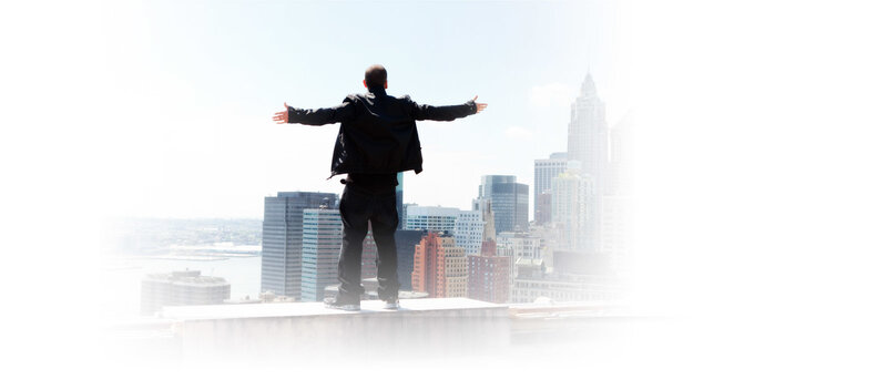 Man Standing on Rooftop