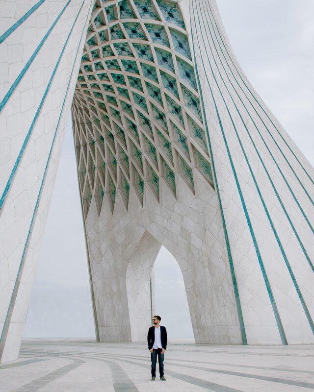Man Standing under Arch
