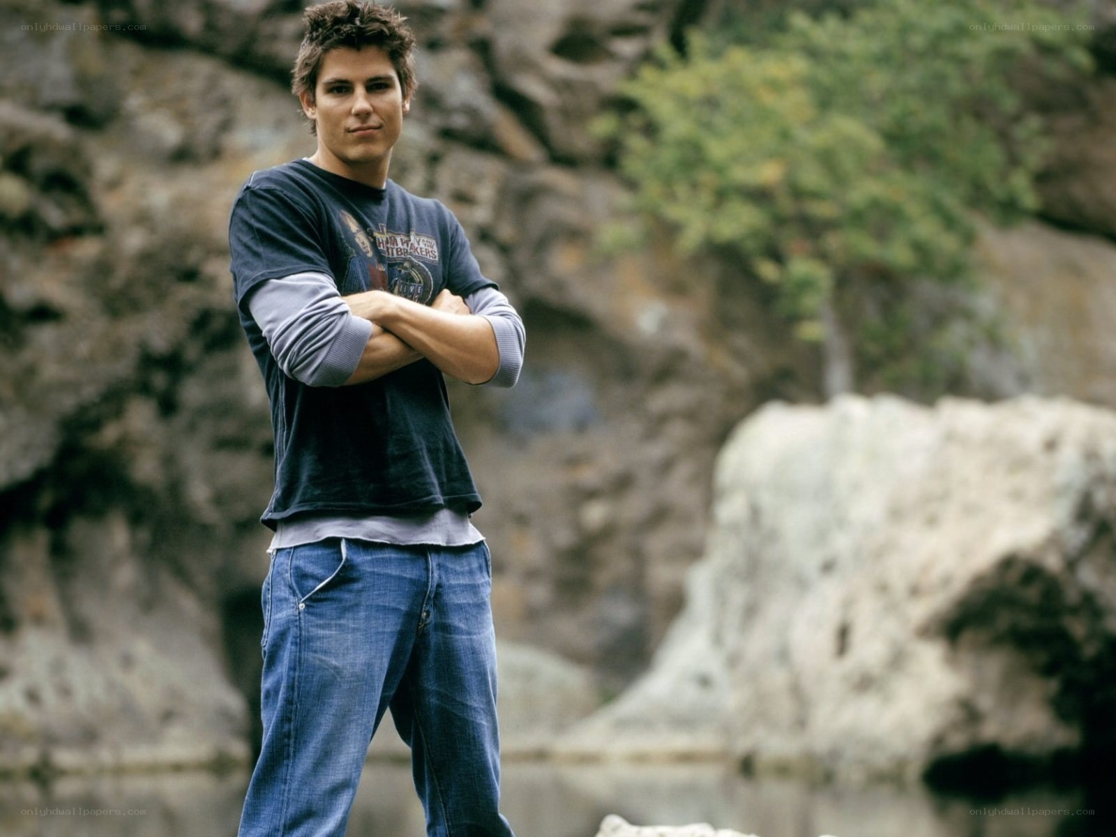 man standing with arms crossed